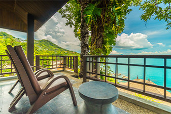 balcony of private villa overlooking a tropical beach